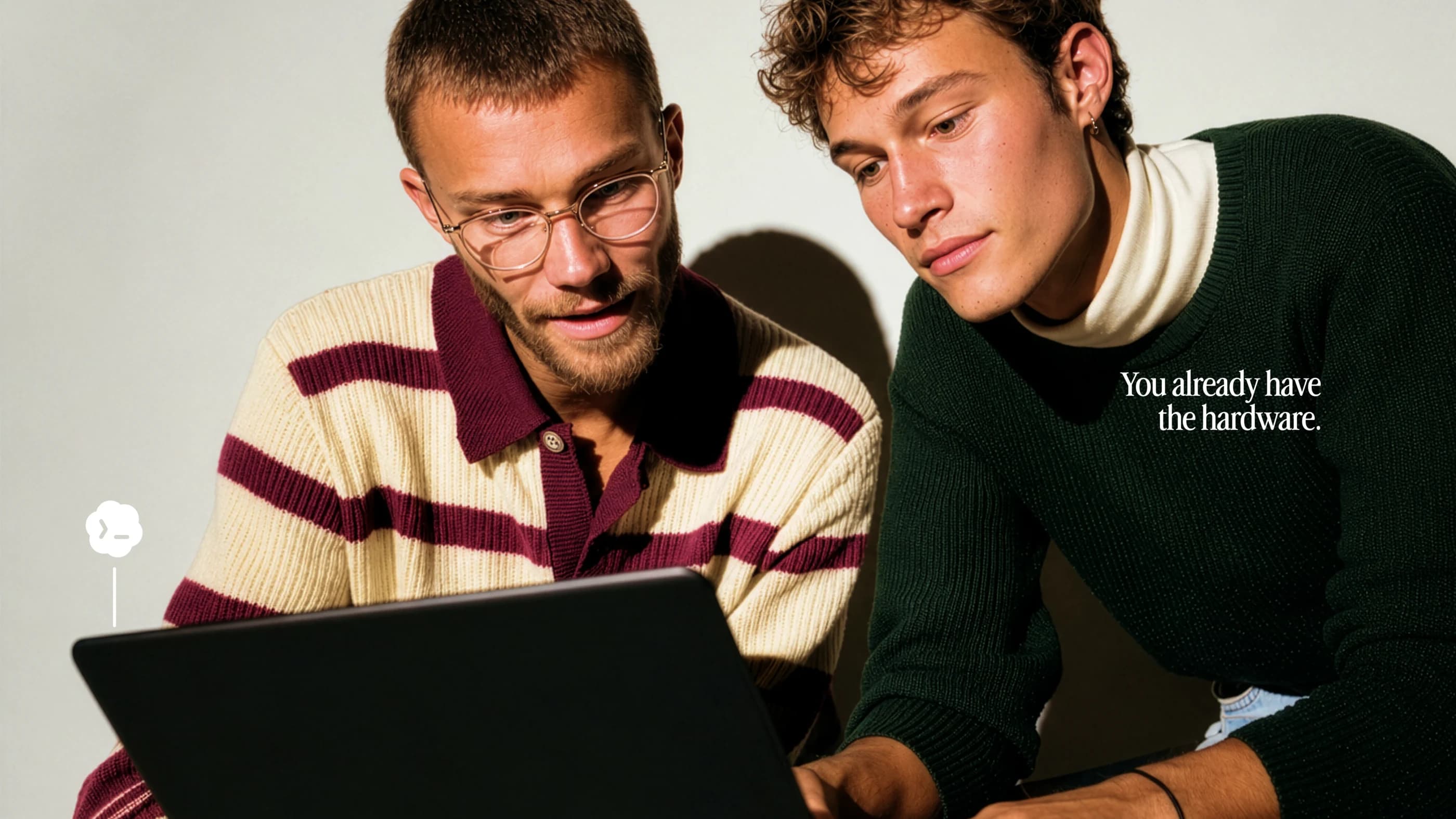 Two developers working together at a laptop